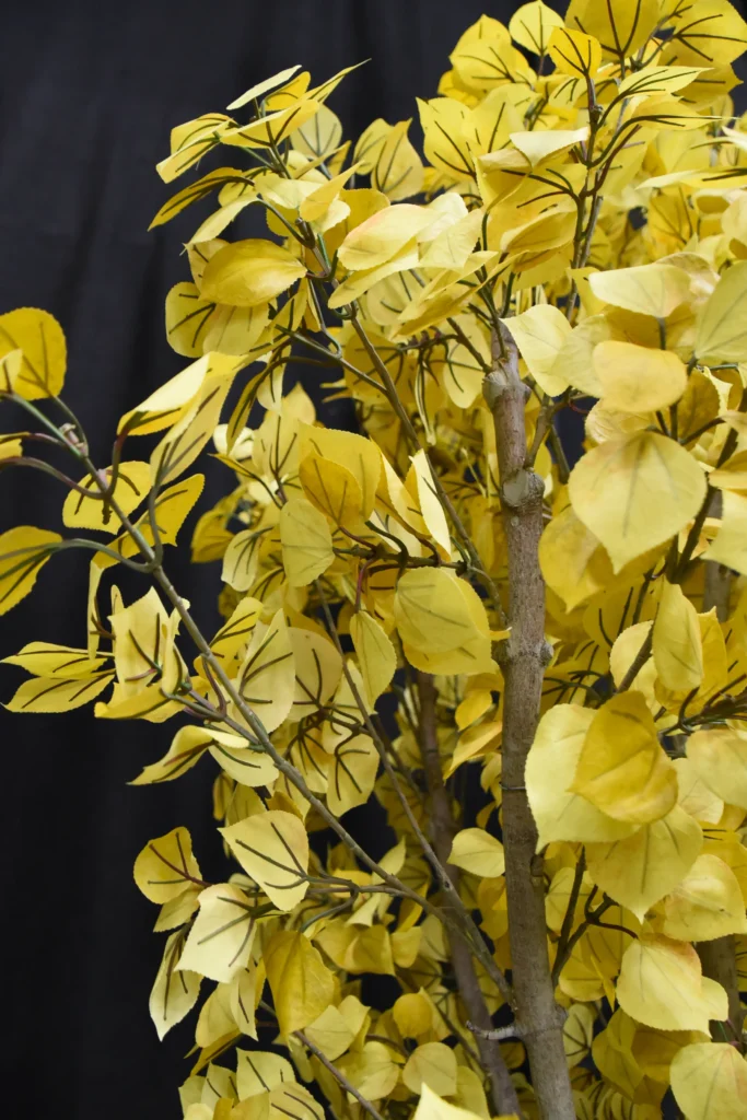 Artificial Yellow Aspen tree with slender gray-brown trunk and clusters of golden-yellow serrated leaves.